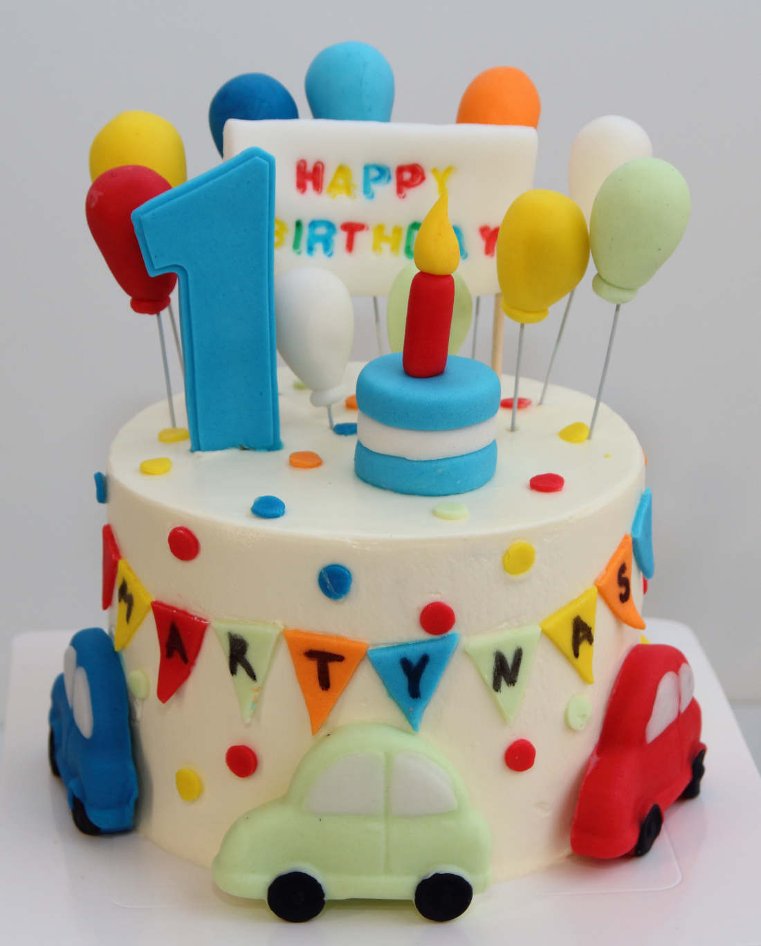 Cars on a cake for a boy's first birthday