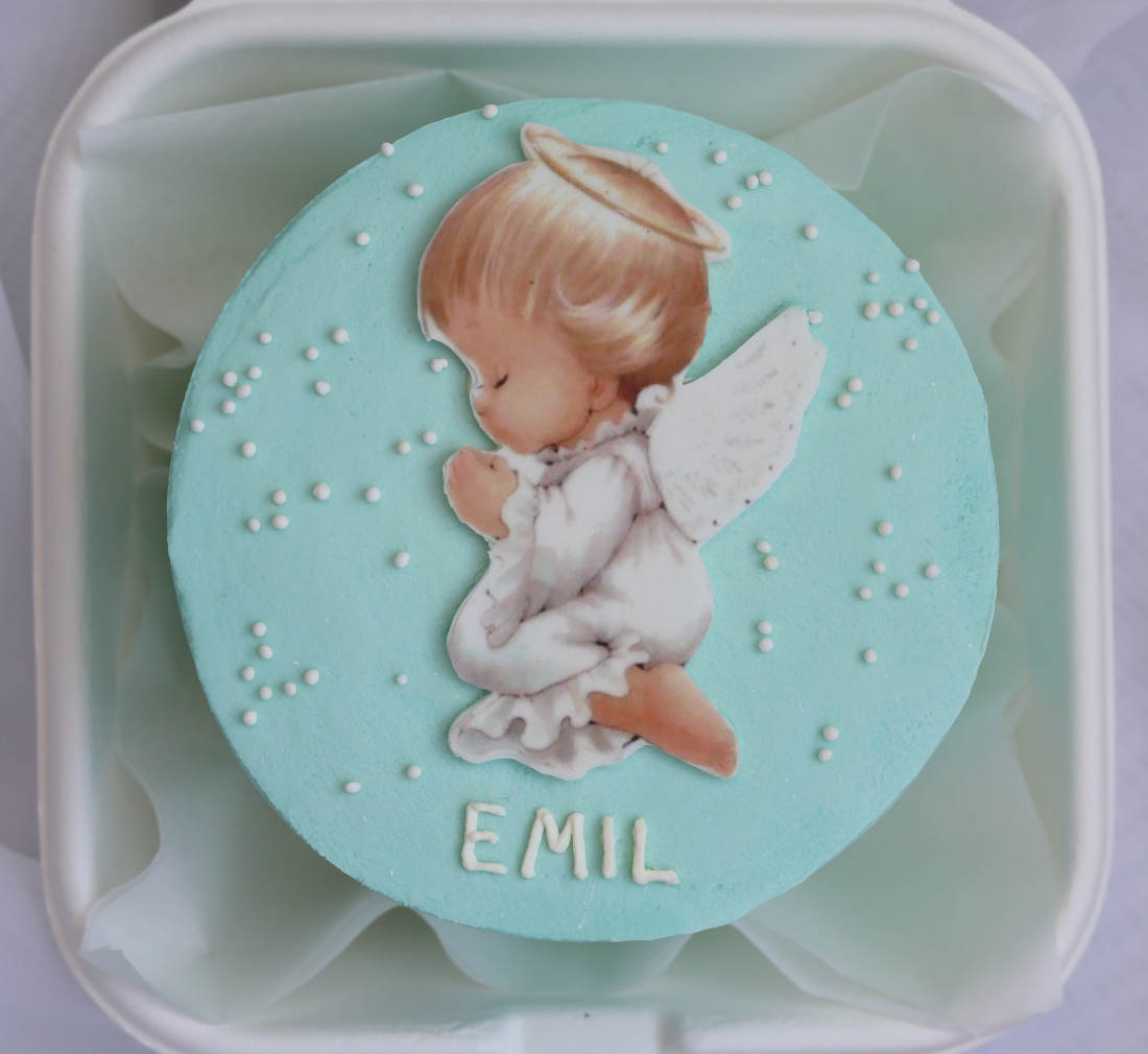 Blue bento cake with angel and confectionery sprinkles
