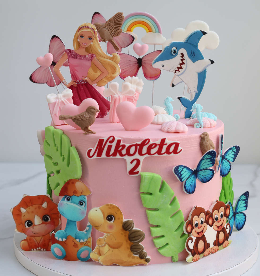 Cake for a girl featuring Barbie and butterflies
