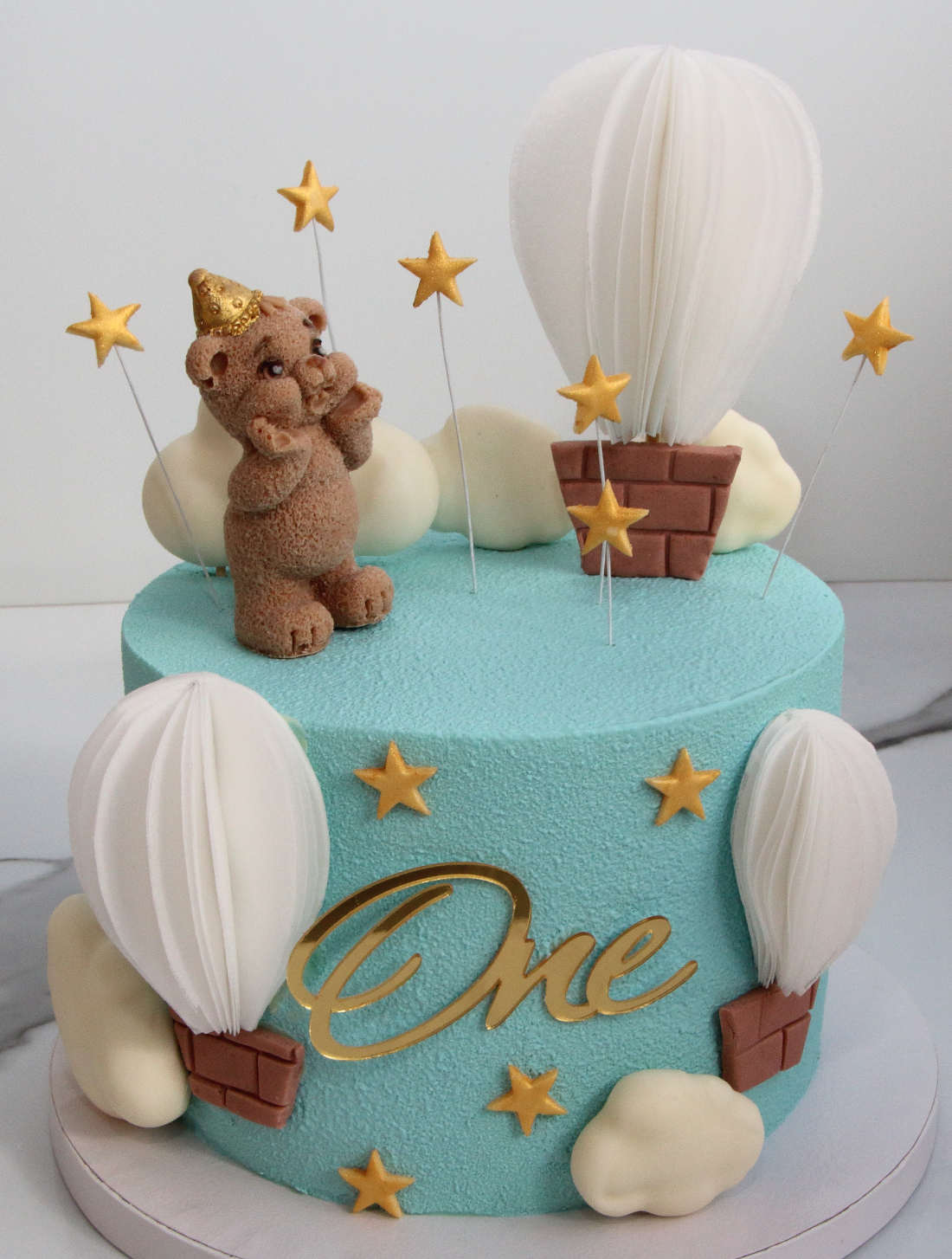 Blue cake for 1 year old boy with clouds and air balloons