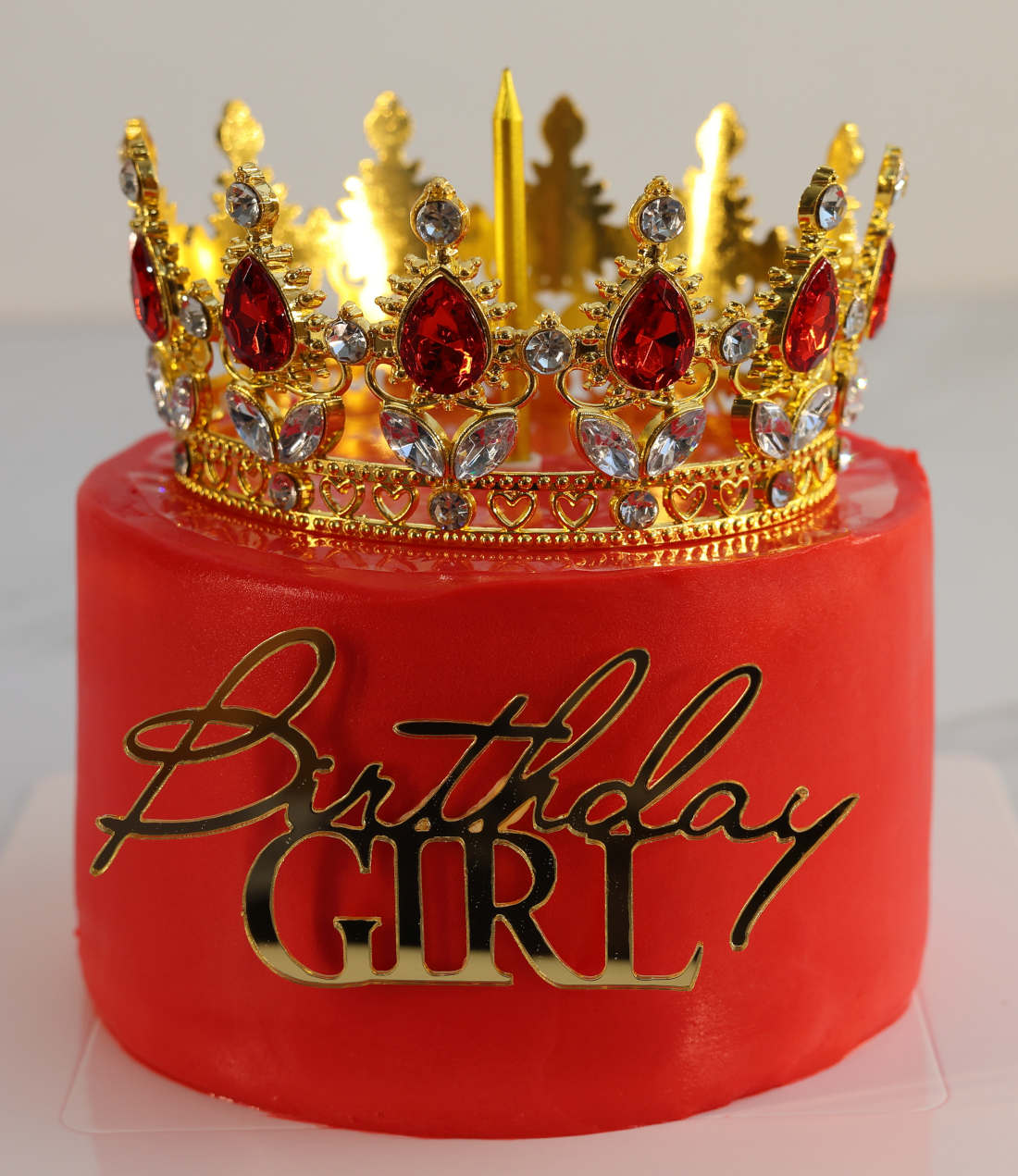 Crown on a red bento cake for a girl's birthday