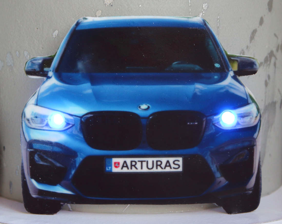 Cake with birthday person's name on the vehicle registration plate