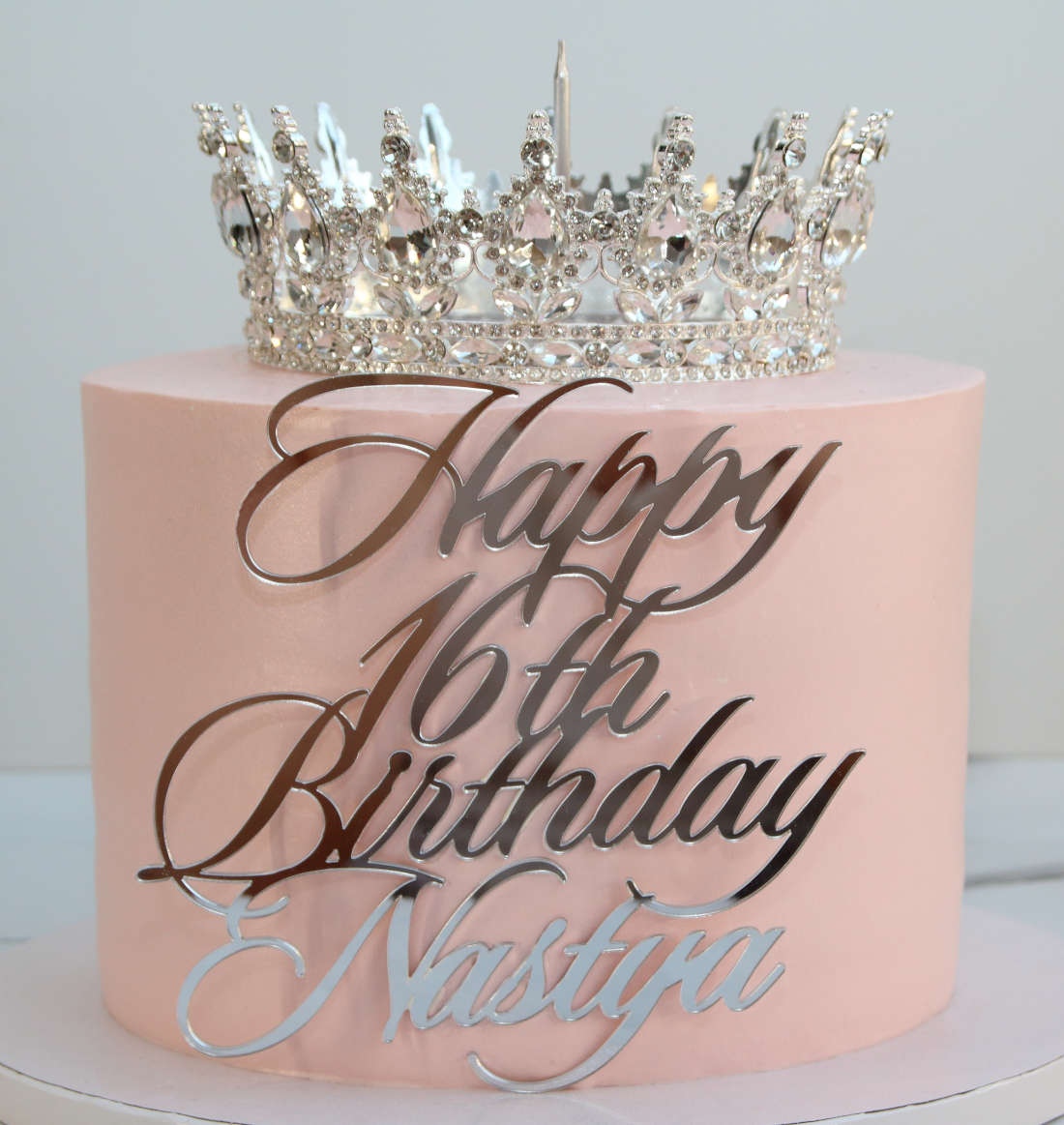 Diamond crown on the cake and acrylic personalized inscription with name and age 16
