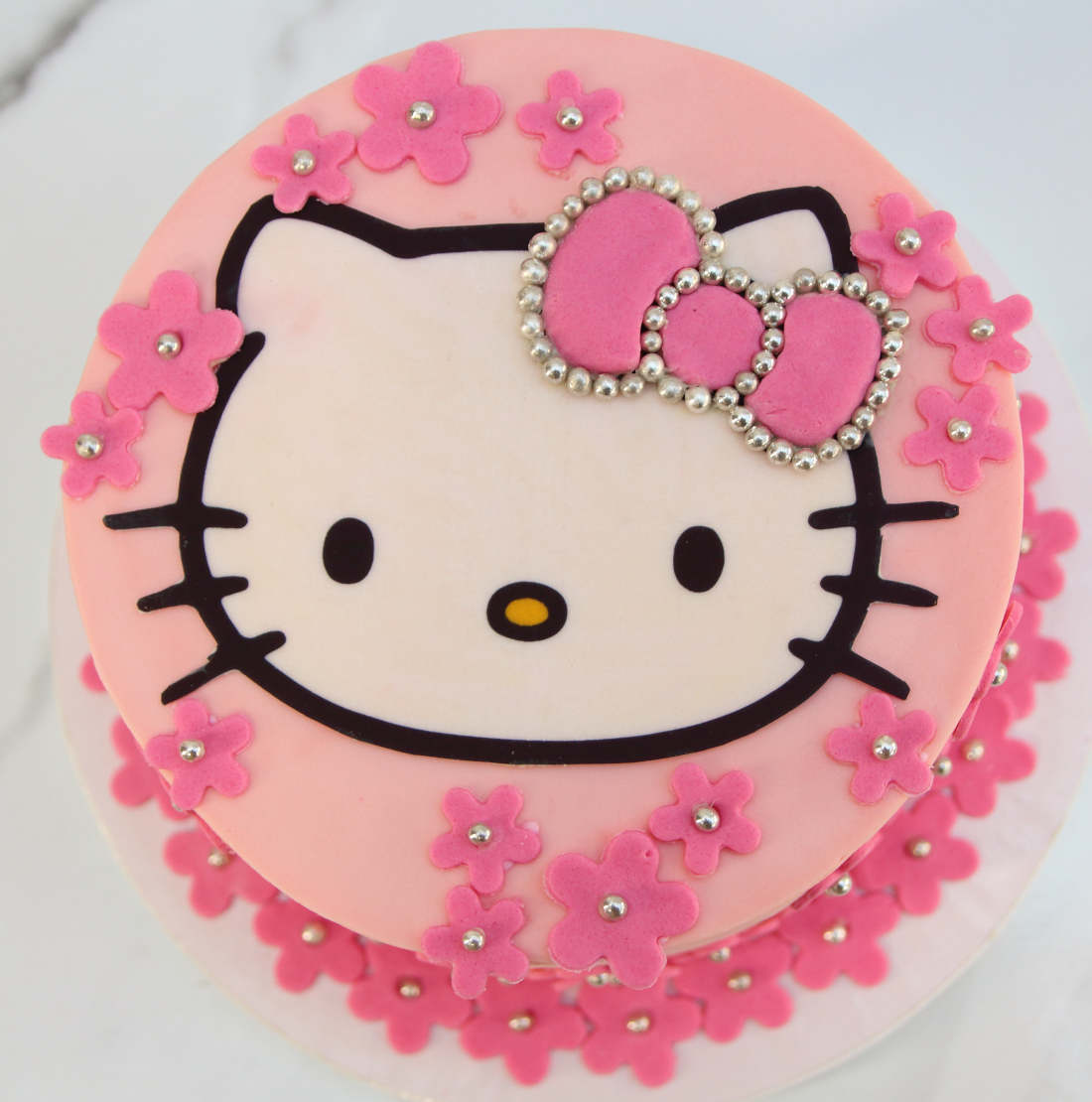 Cake with flowers and bow for girl