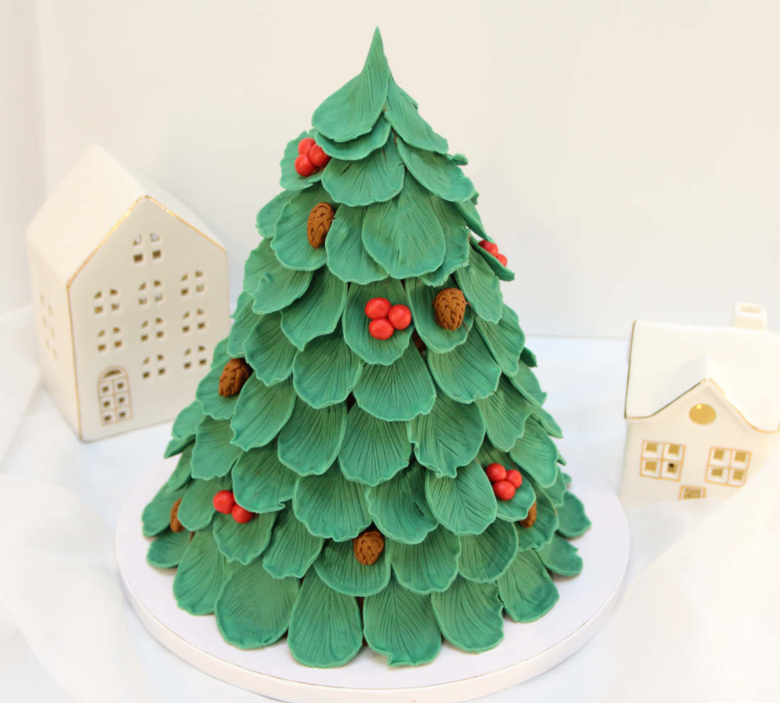 Cake in a shape of a Christmas tree for New Year holidays