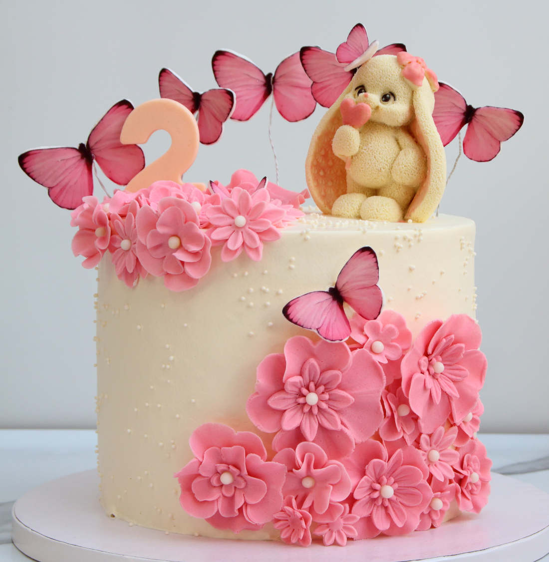 Flowers and butterflies on a cake for a girl's birthday