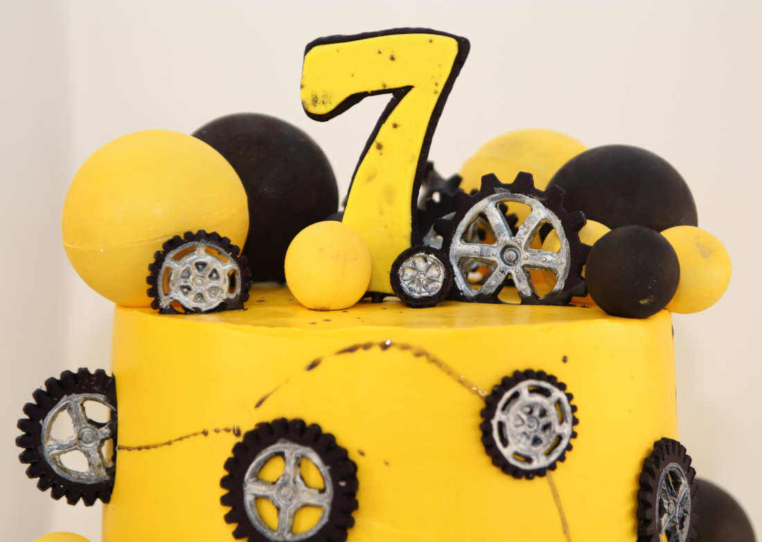 Balls and wheels on a cake for a child