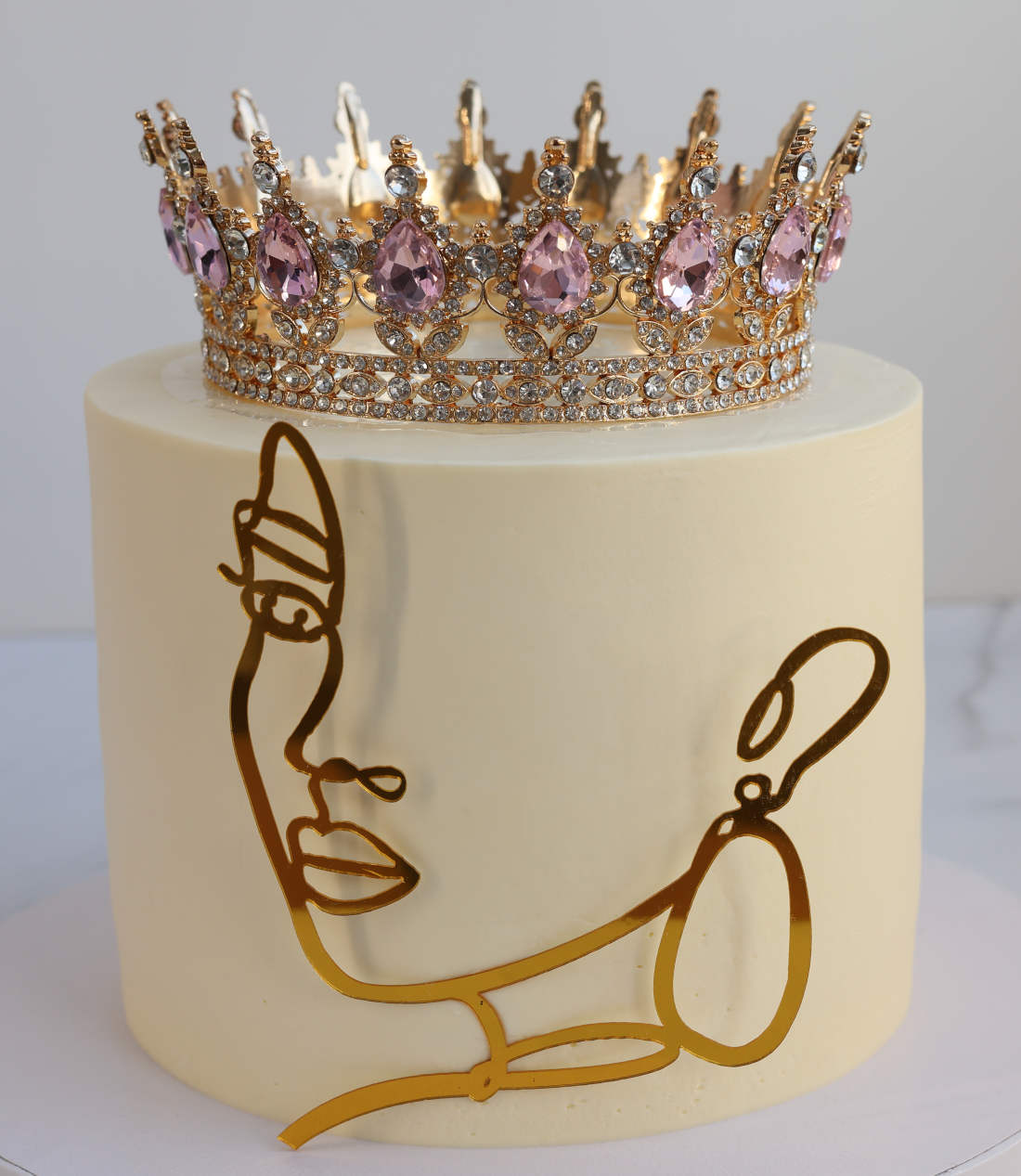 Girl with the crown on the cake