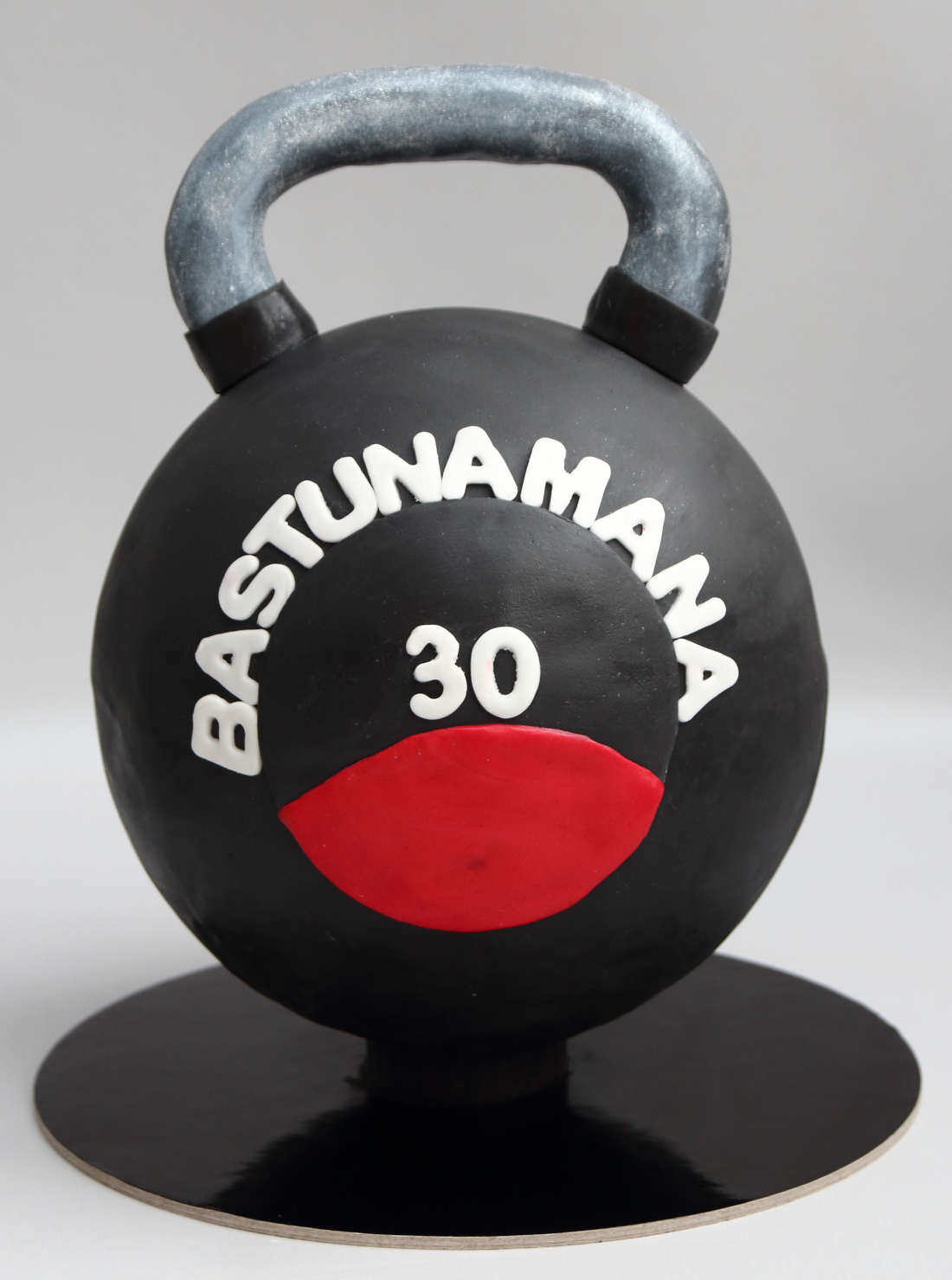 Chocolate kettlebell cake, covered with fondant icing