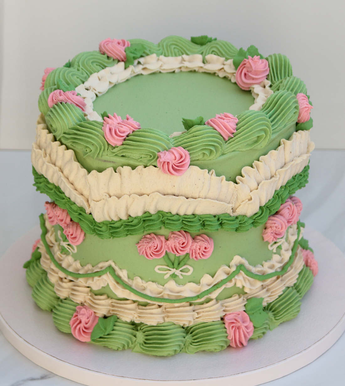 Sugar-free Lambeth vegan cake with green, pink and white cream