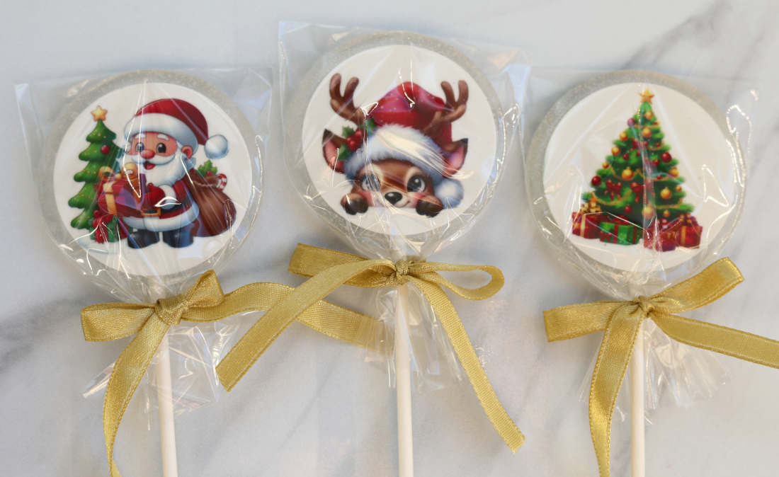 Lollipops with Santa Claus, a Christmas tree, and a reindeer