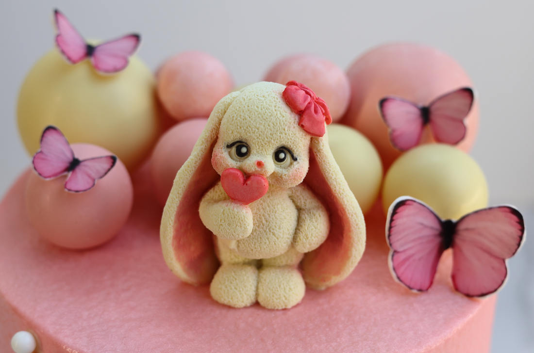 Butterflies and the chocolate bunny on the cake