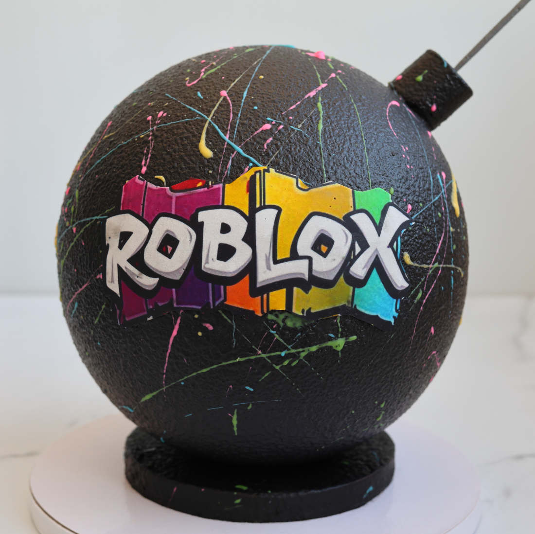 Bomb cake with the Roblox logo