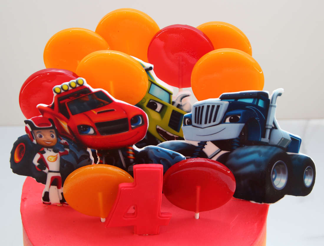 Lollipops, AJ, Blaze, Zeg and Crusher on the cake