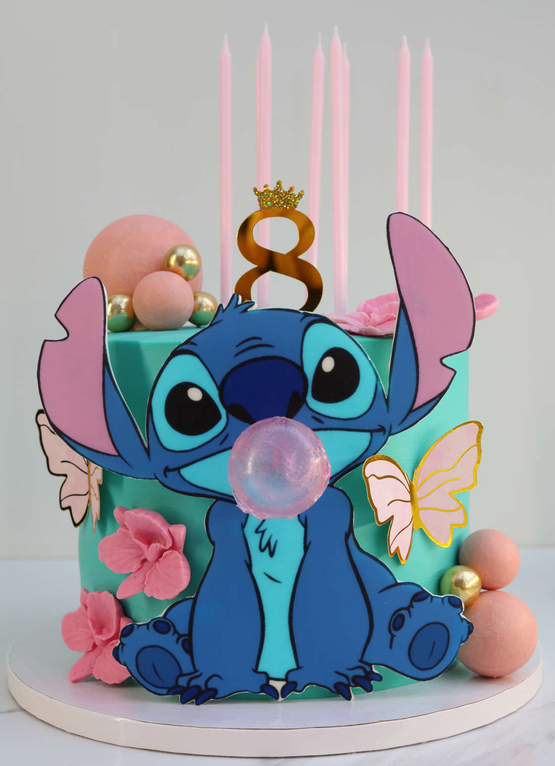 Stitch blows a gum bubble on the cake