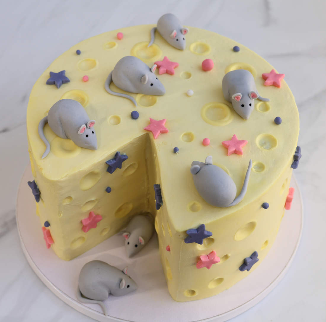 Cheese-shaped cake with mice