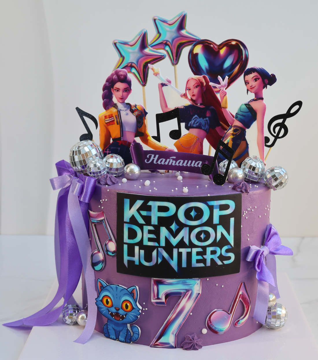 KPop Demon Hunters cake with ribbons and mirror balls