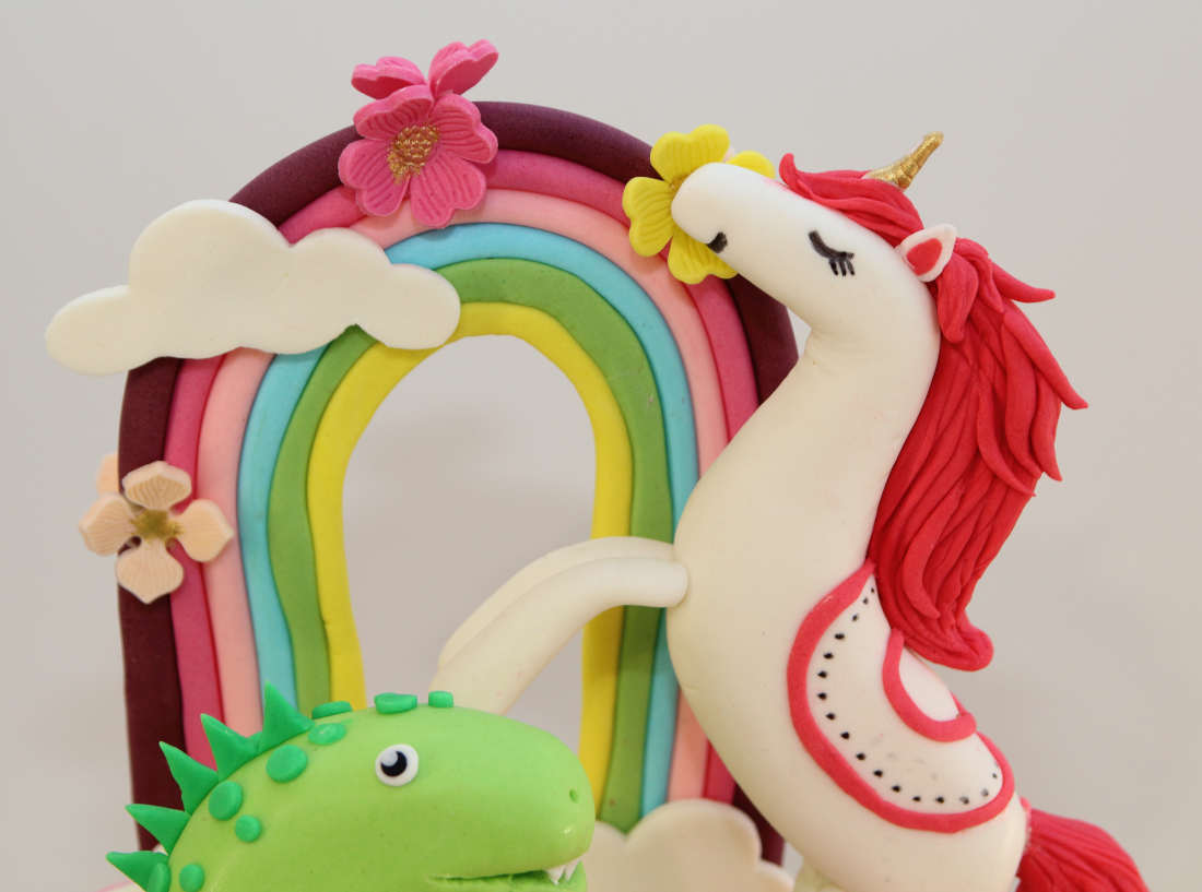 Unicorn next to a rainbow