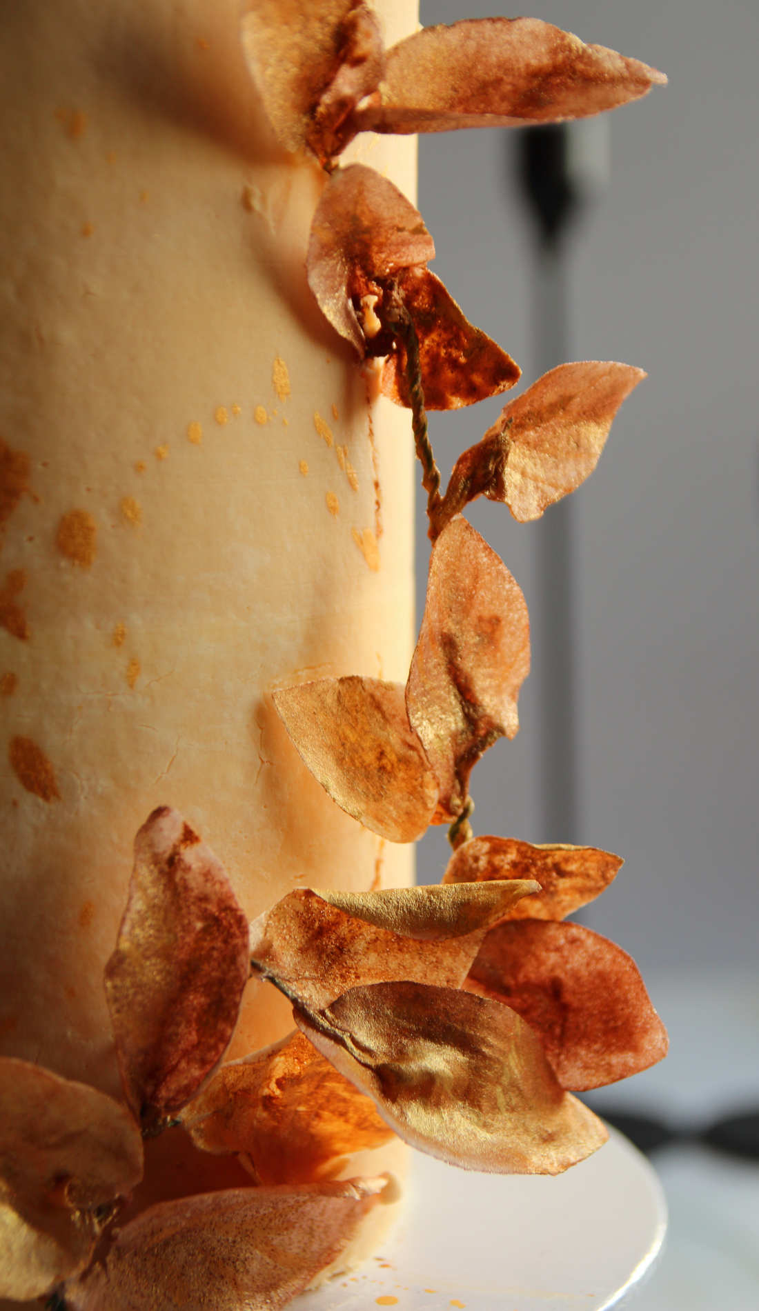 Birthday cake decoration with golden leaves