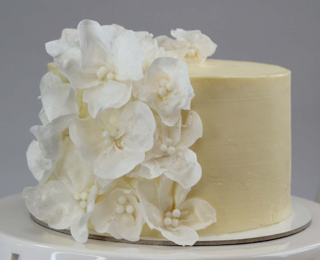 White wedding cake with flowers