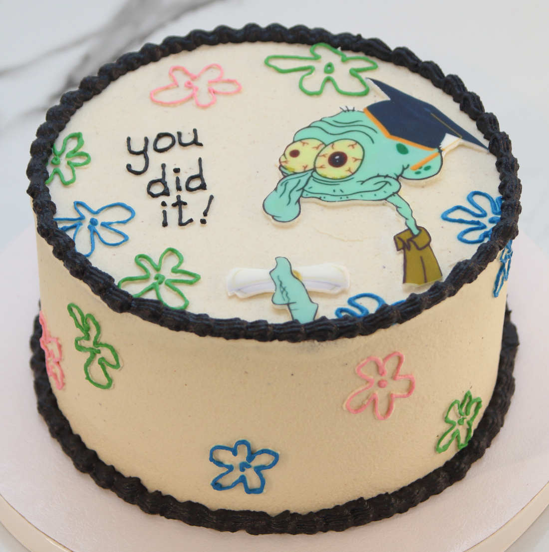 Vegan cake with an inscription for a student who passed an exam and received a diploma